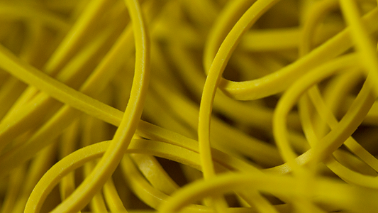 Joe Rindfleisch's SIZE 16 Rainbow Rubber Bands (Russell Leeds -Yellow ) by Joe Rindfleisch - Trick alternate view - Wizard Magic Shop